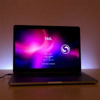 A secure operating system like Tails or Whonix running on a laptop with the boot screen visible, showing privacy-focused security features being initialized